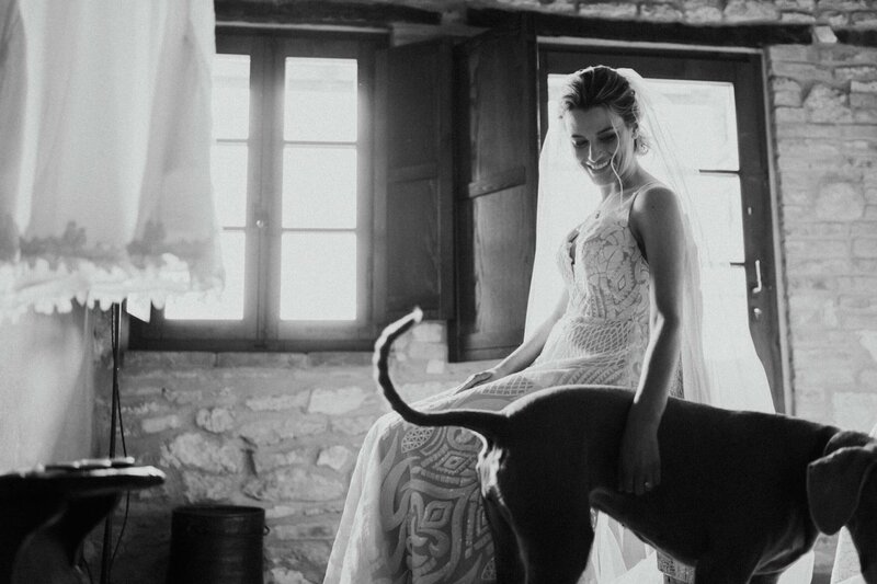 bride getting ready in tuscany candid moment