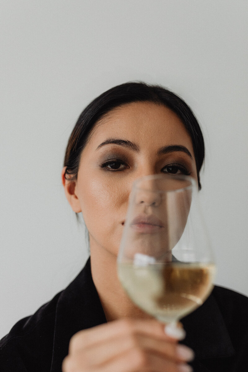 kaboompics_sophisticated-wine-tasting-portraits-modern-asian-woman-in-elegant-black-outfit-holding-white-wine-glass-33691