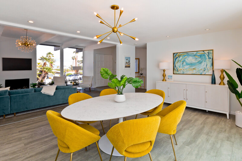 Home Staging dining room with yellow chairs and white modern table