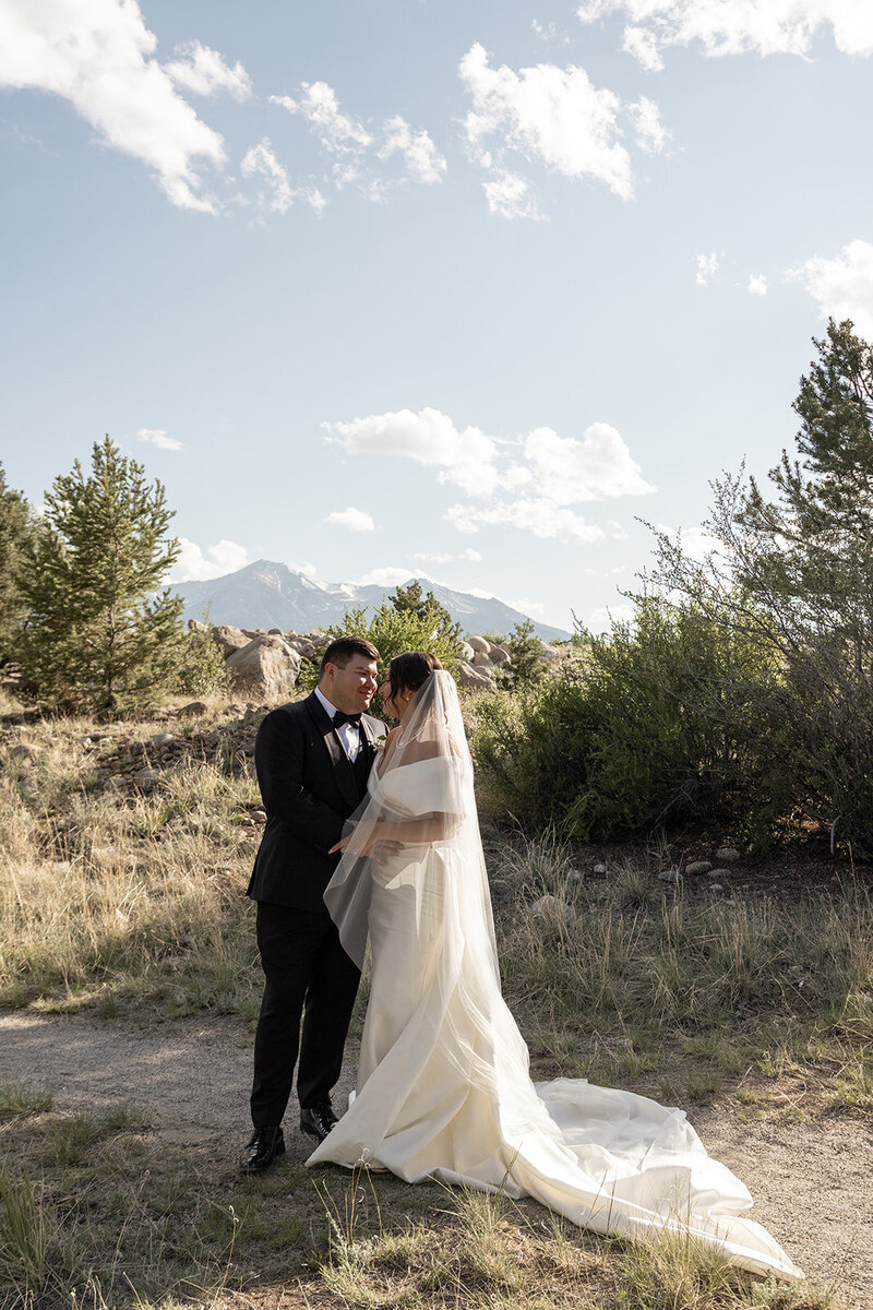 bride and groom in a white paneled room