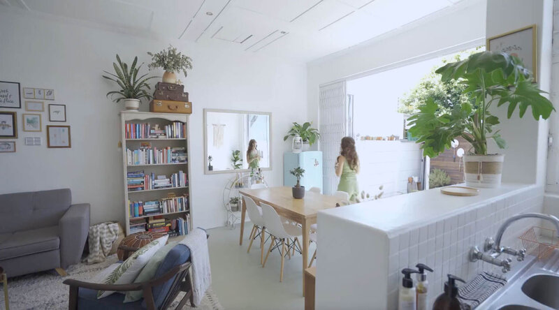 Minimalist home in North Atlanta Georgia, showing a dining room table and bookcase