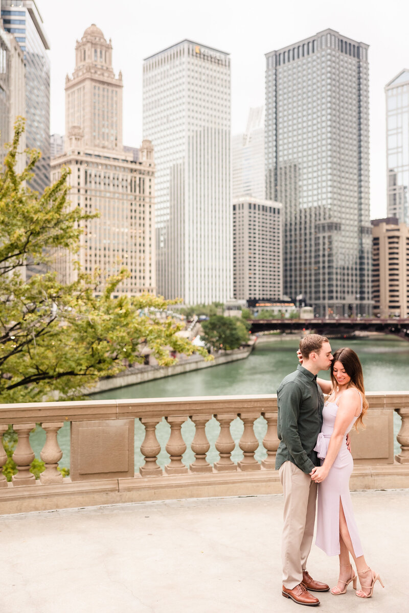 Couple celebrate their engagement along the Chicago riverfront.