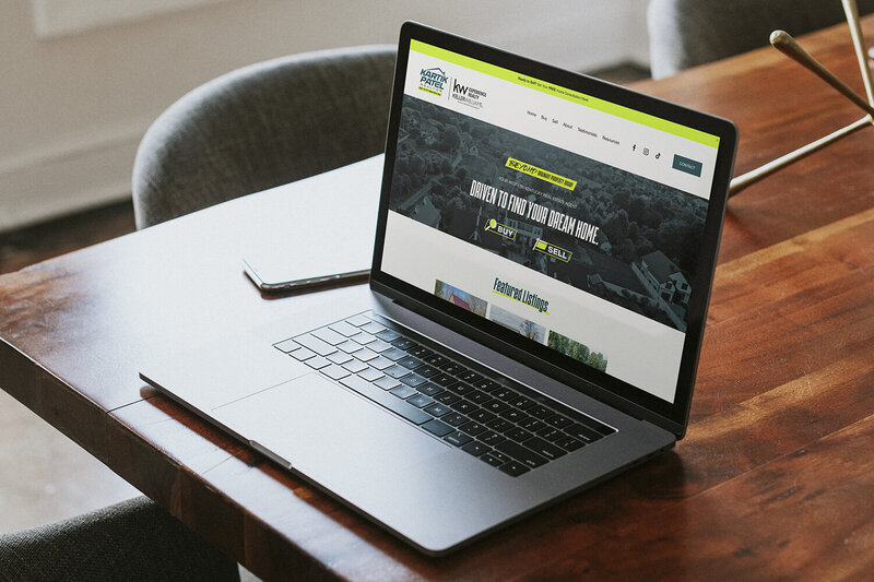 Laptop with Kartik Patel Realtor Website home page on screen designed by Amanda Newman Design in Paducah, Kentucky