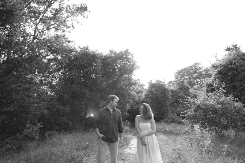 black and white engagement photos in Portland Maine during golden hour