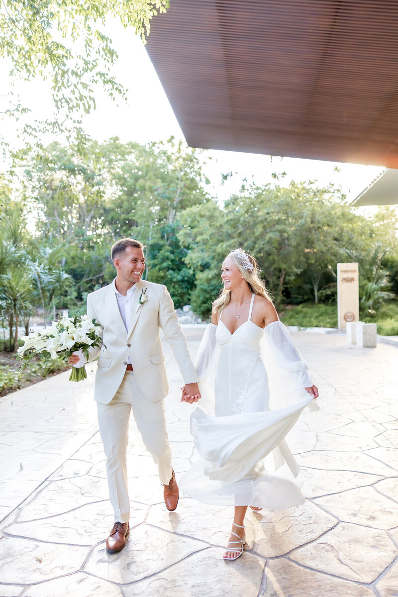 A couple exiting their ceremony in Tulum, Mexico.