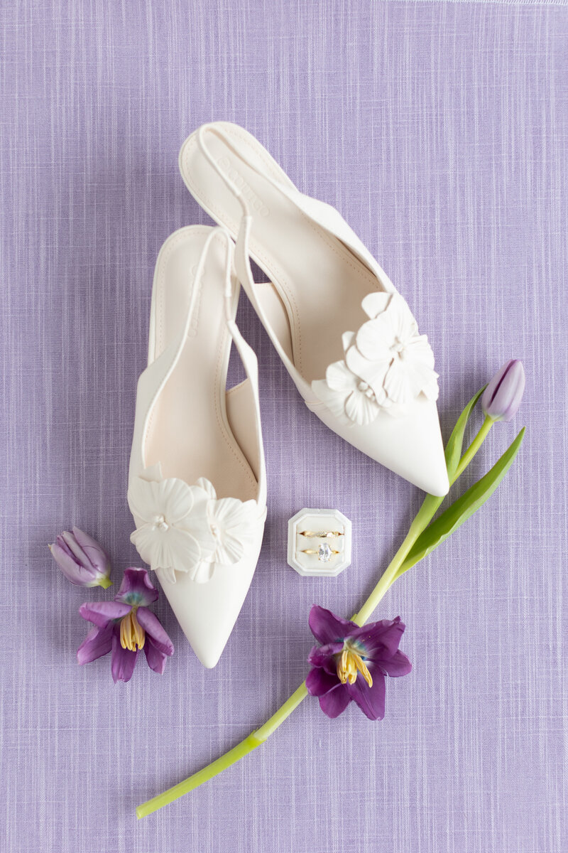 Purple linen flat lay mat with creative wedding details and lavender accents