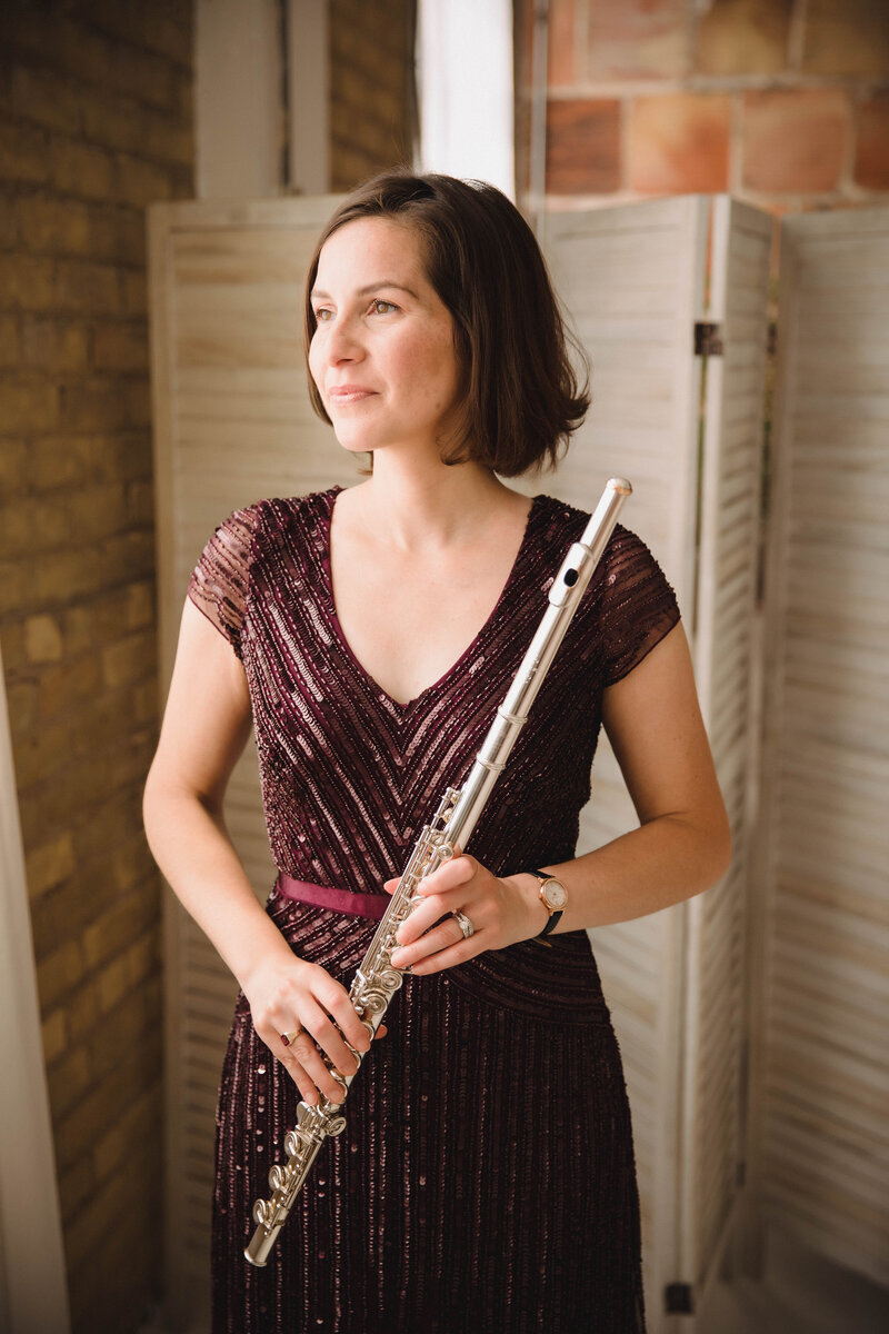 Sarah Weisbrod, Twin Cities Flutist & Teaching Artist, Looking  Out a Window with Flute