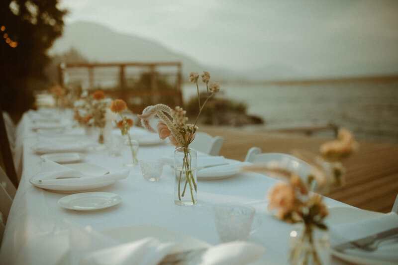 Wedding table decor with vase and flowers by the coast