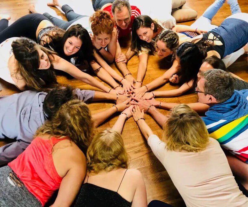 Students creating heart mandala during therapeutic yoga teacher training California