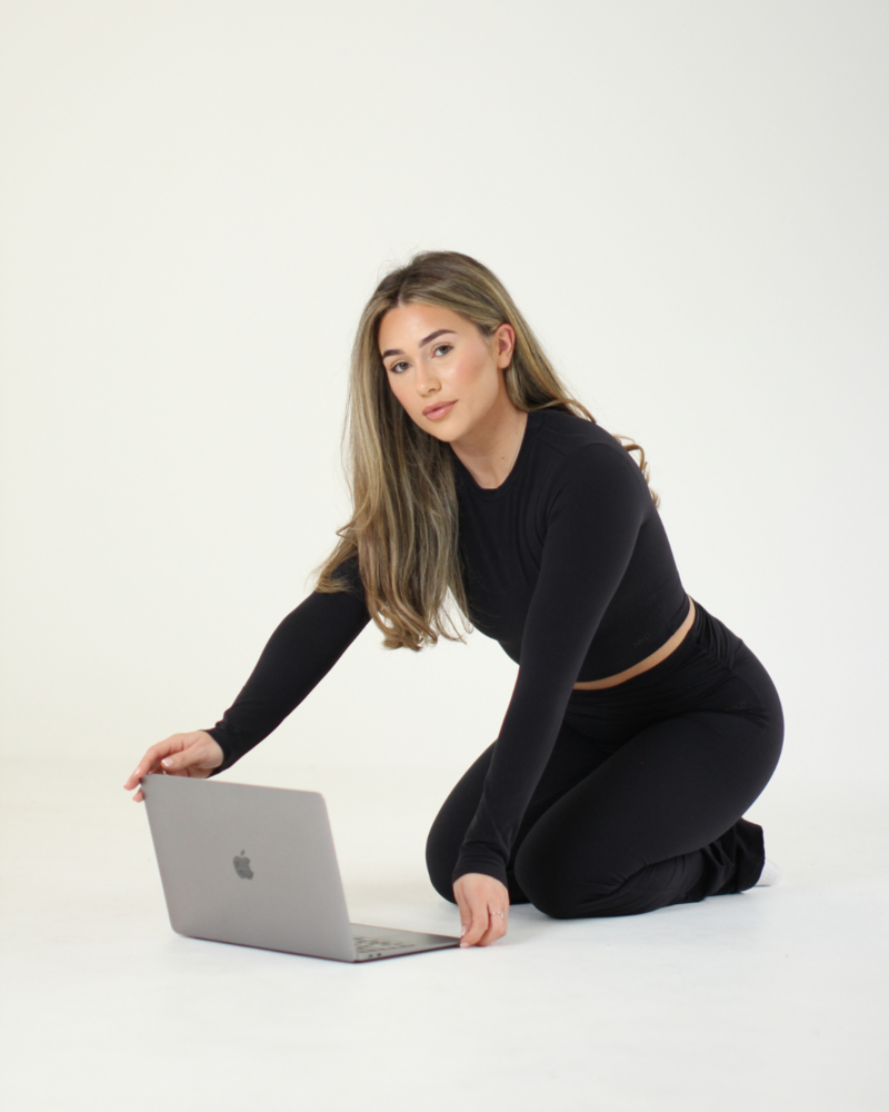 Business women working on her laptop and phone