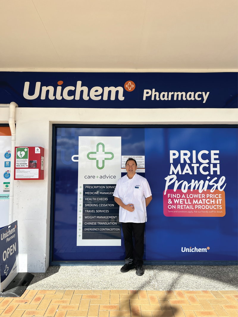 Owner of Unichem Northcote Pharmacy Anthony Yee standing in front of store