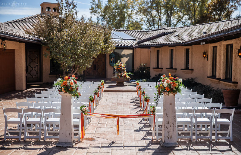 Outdoor Sunny Wedding Ceremony set up in Courtyard of Villa Parker