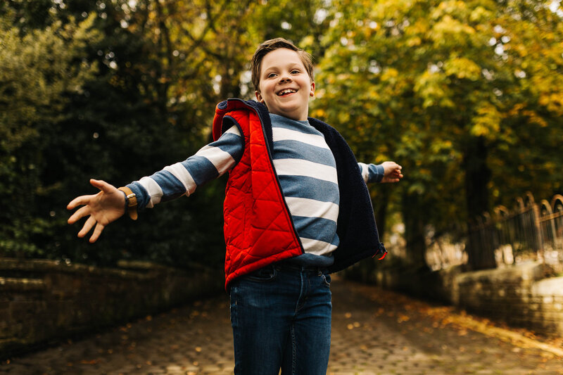 a young boy jumping during a family shoot