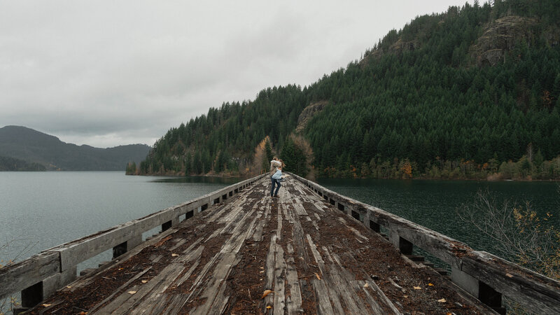 Couple on a trestle bridge in Campbell River during their engagement session by latitude 49 photography