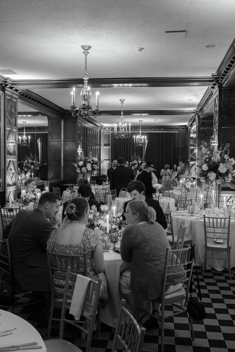 Guests enjoy dinner at Hotel Kansas City Tudor Ballroom wedding reception