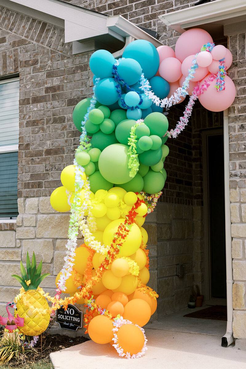 Colorful balloon arch for luau party planned by Bianca Nichole and Co