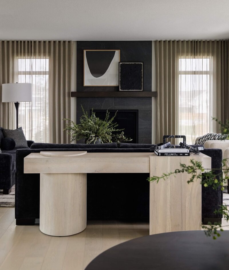 A oversized wooden console with abstract shapes and art. 