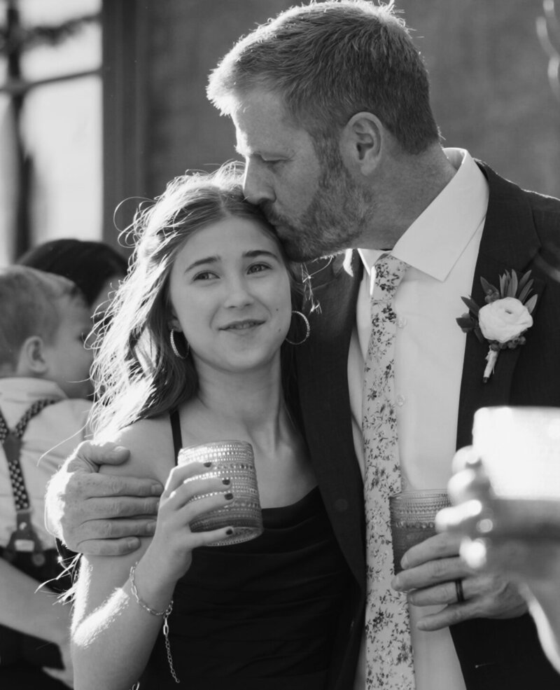 Dad embracing daughter on wedding day