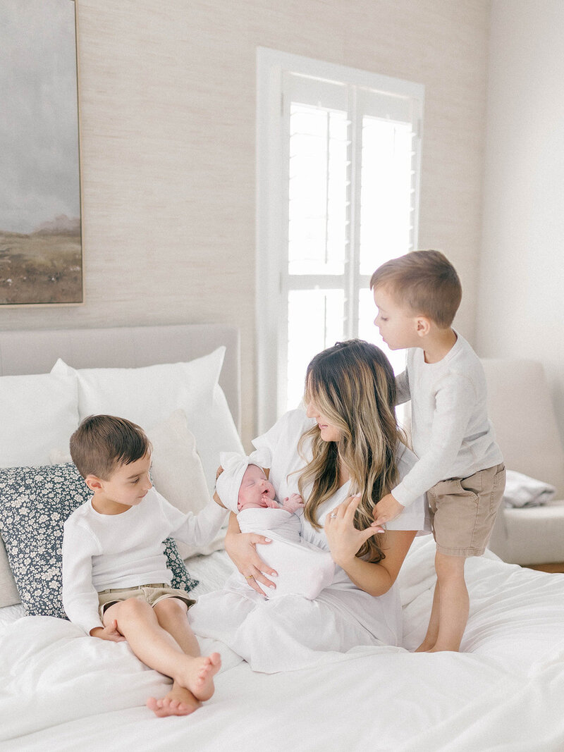 Mom with her sons and newborn baby girl