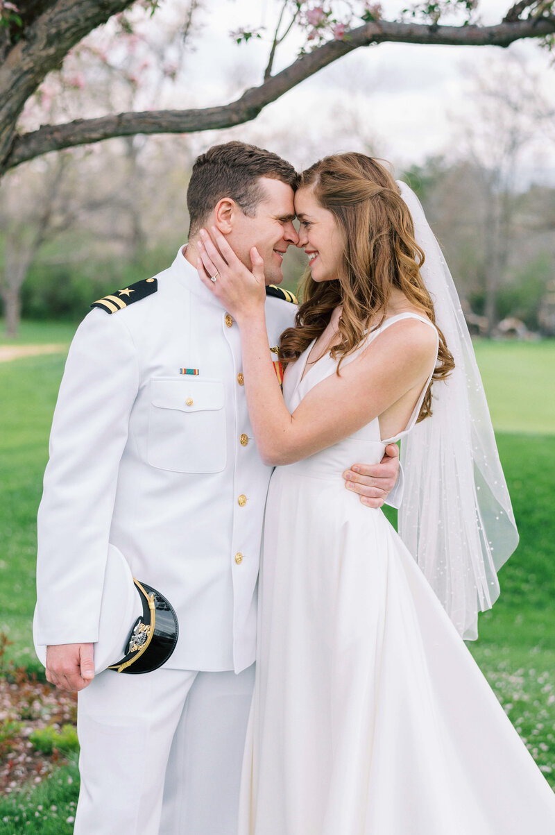 Naval Officer and Bride take photos together during their Virginia Wedding