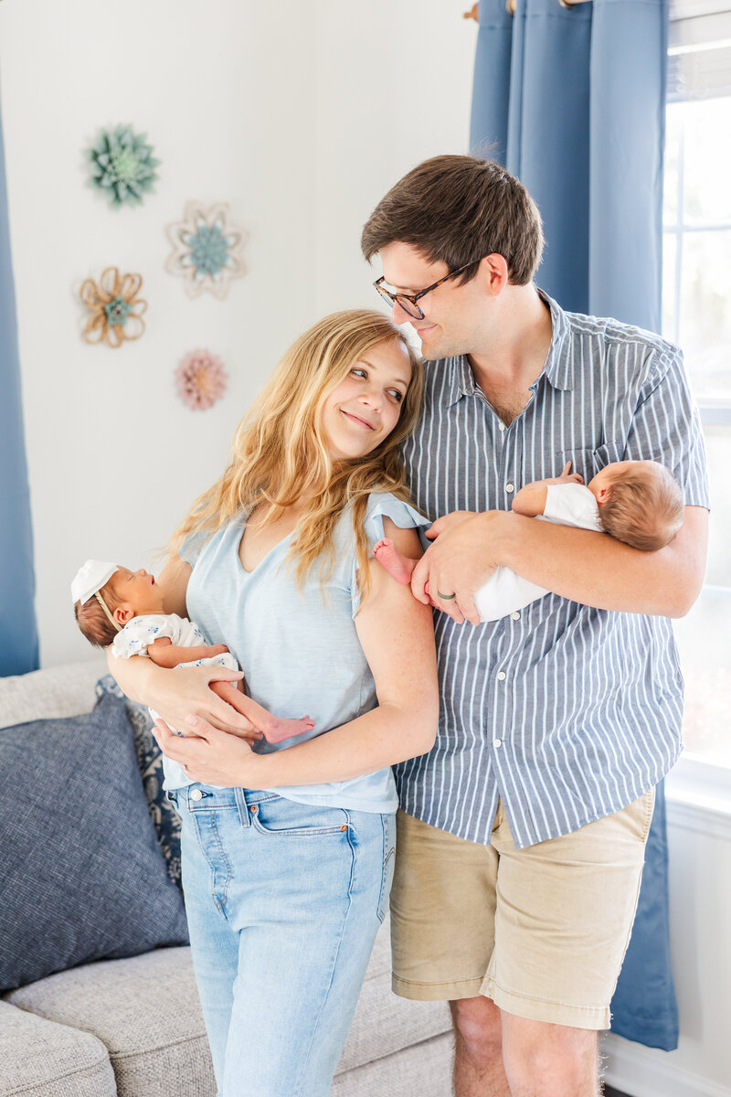 mom and dad holding twin babies in Charleston South Carolina
