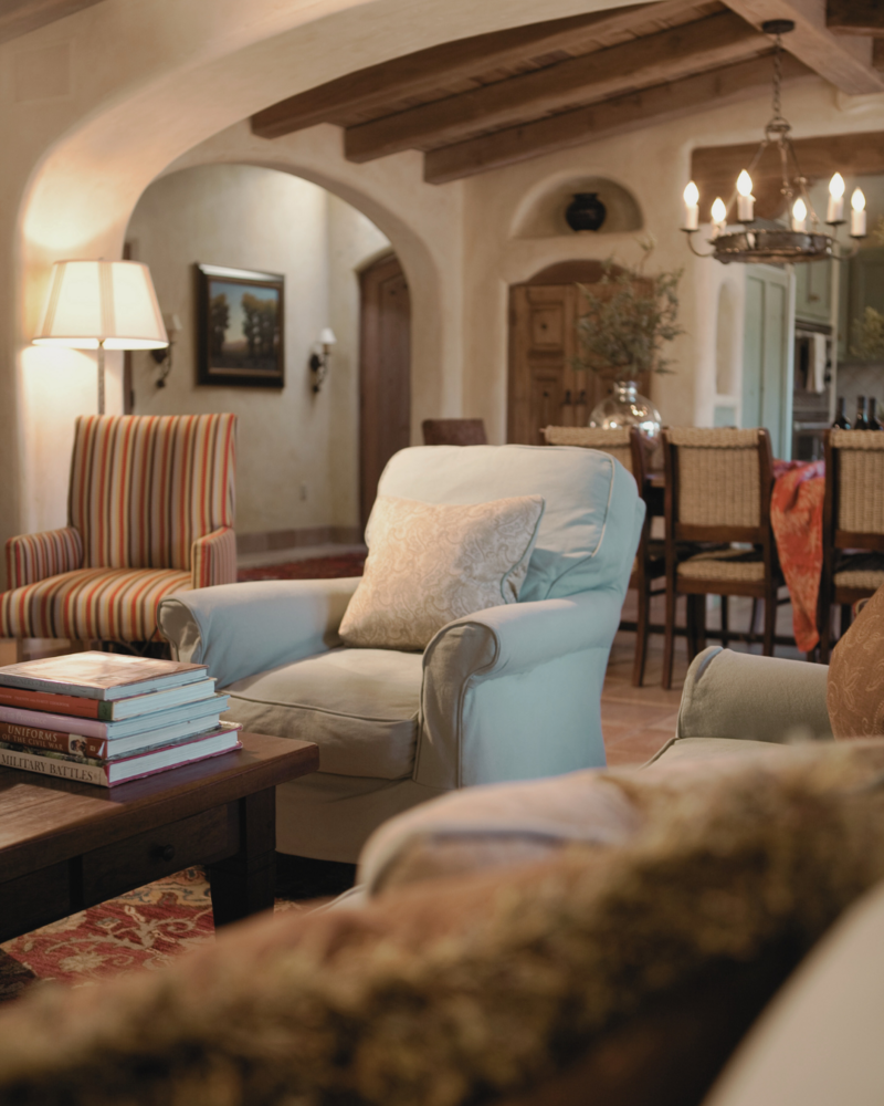Rustic Spanish style  living and dining room with robin's egg blue slipcovered sofa and chairs