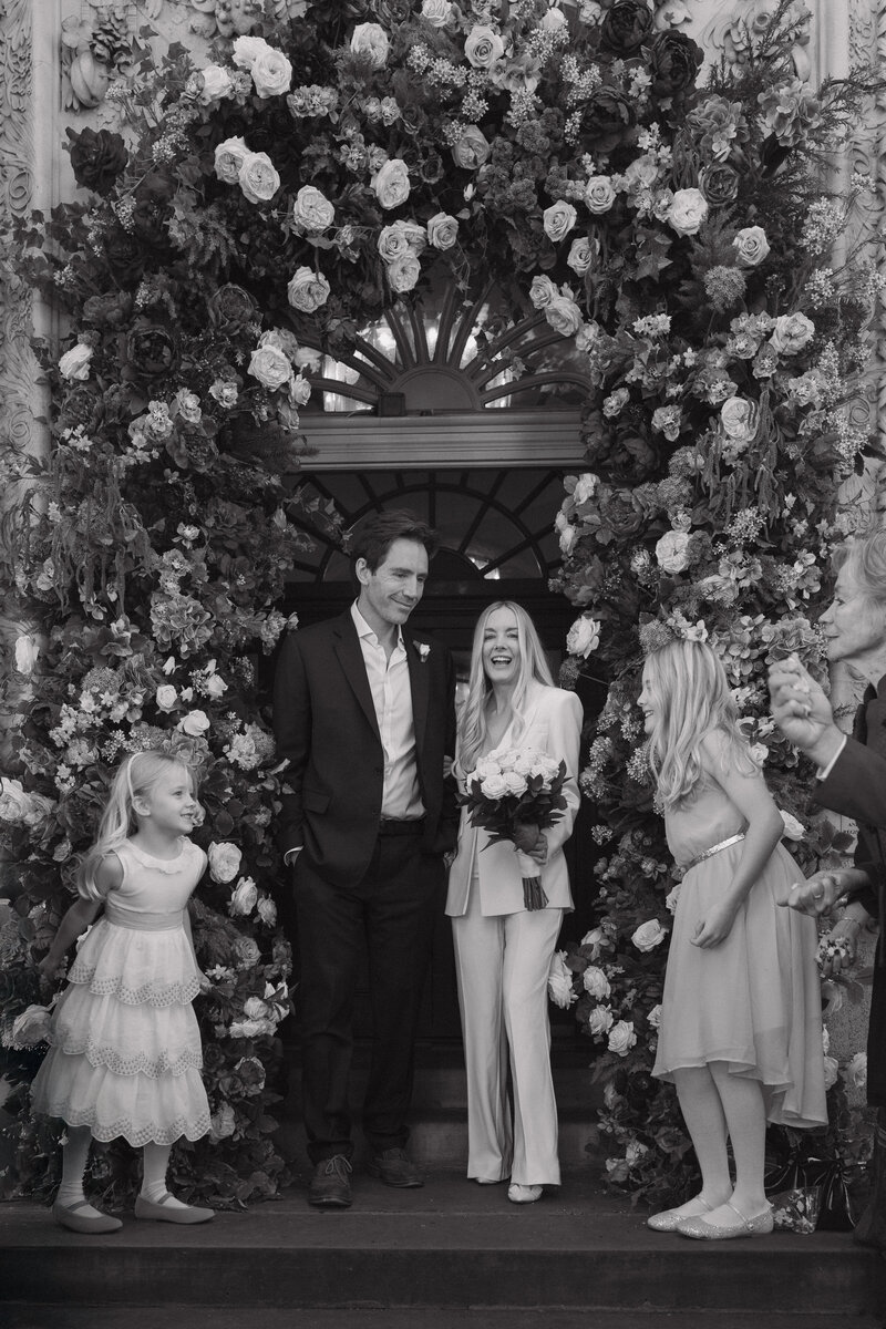 Francesca and steve smile for a photography at there sunny luxury wedding ceremony in north yorkshire