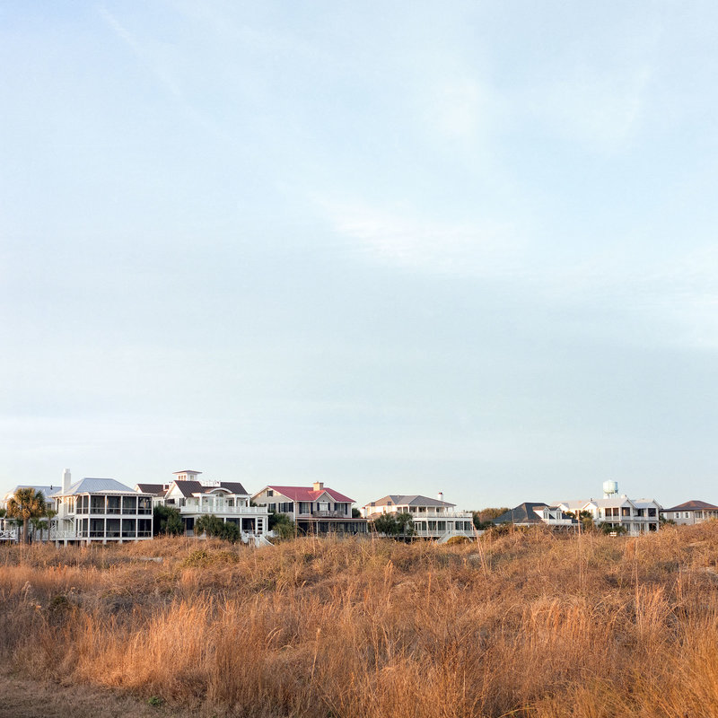 A row of Sullivan's Island beach houses behind beach grass