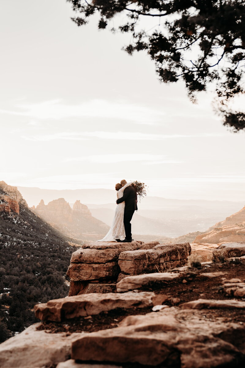 bride and groom eloping on mountain