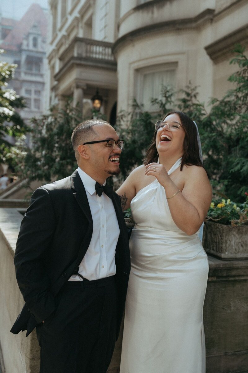 bride and groom laughing outside after elopement ceremony shot by Elsie Goodman Photography | NYC Elopement Packages
