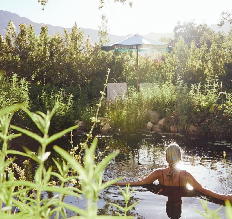 Woman swimming in lake at Sterrekopje Farm