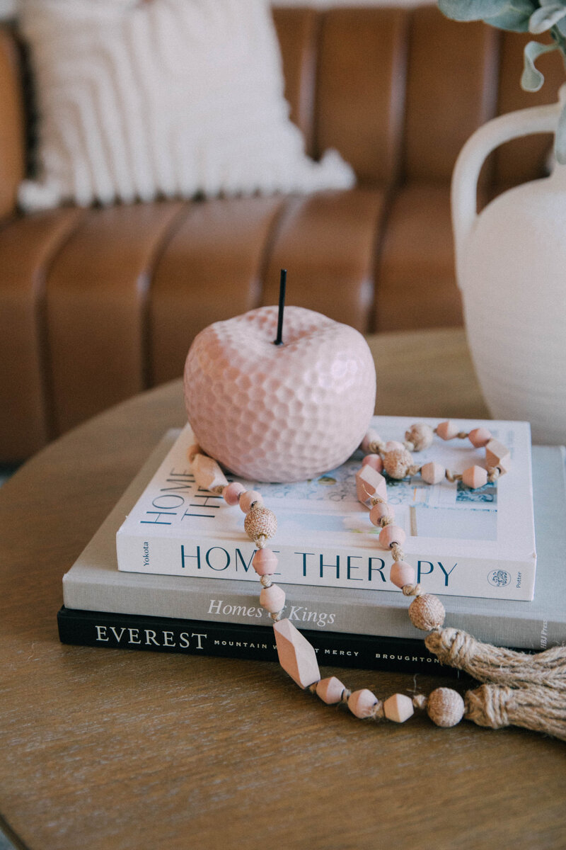 Sitting room staged by Modern Mollusk in Snohomish County featuring large windows, neutral furnishings, and soft natural light.