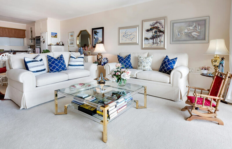 Professionally cleaned living room with blue and white furniture