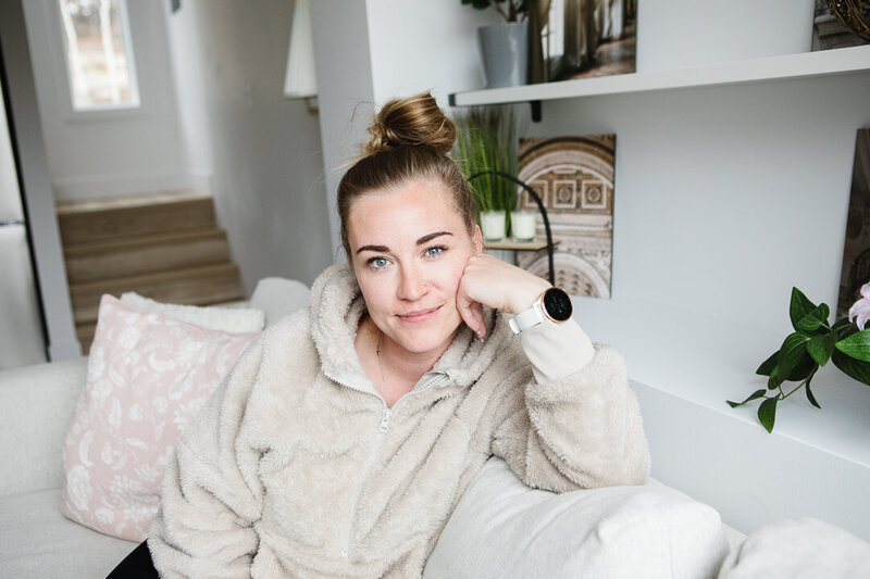 Southern Alberta Realtor Tamara Rzan relaxing in a white cozy home