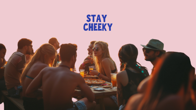 A bunch of people sitting at the table, eating a pizza and it says "Stay Cheeky"