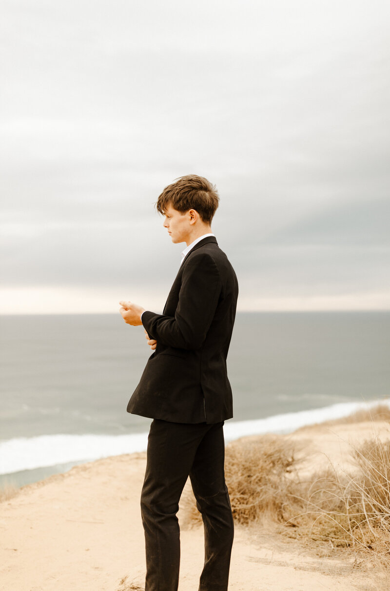 groom at cliffside Laguna Beach elopement