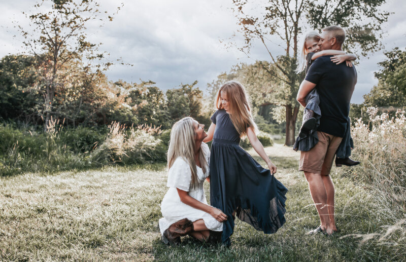 sweet moments between  parents and kids, on the green field of Toledo