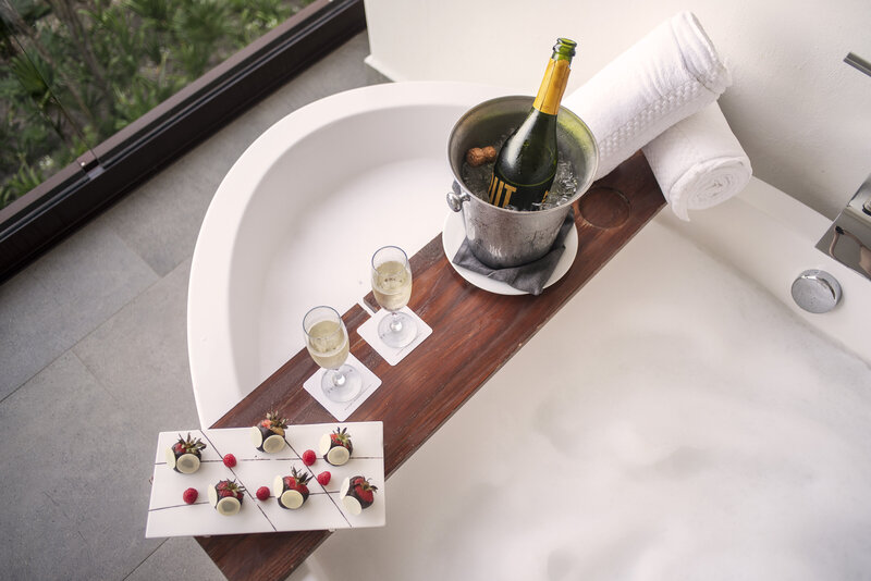 Food and wine served at a hot tub