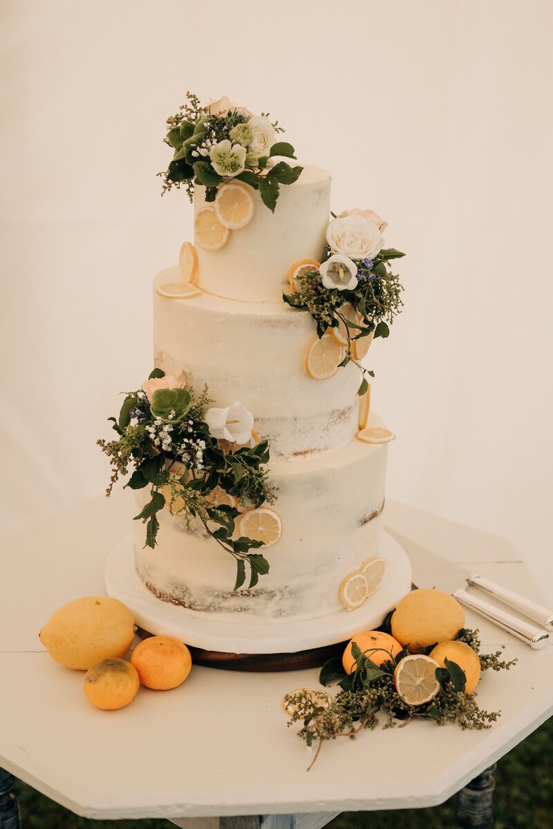 lemon citrus themed wedding cake at farm chapel venue in waimumu