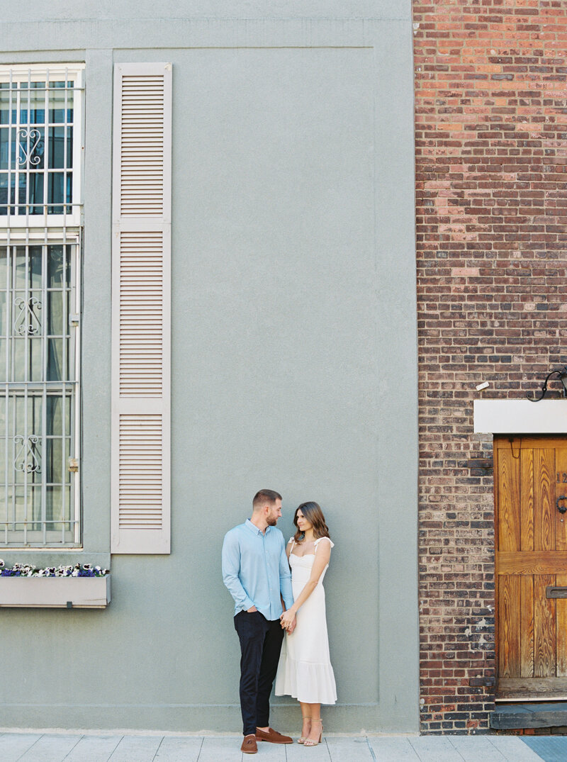 Couple embrace during their chic engagement session in West Village in NYC