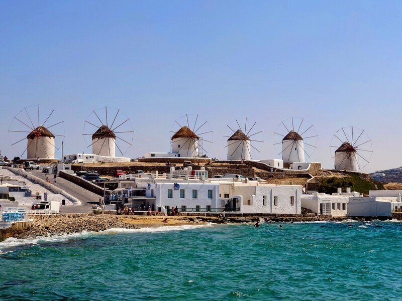 Windmills on the beach in Santorini Greece