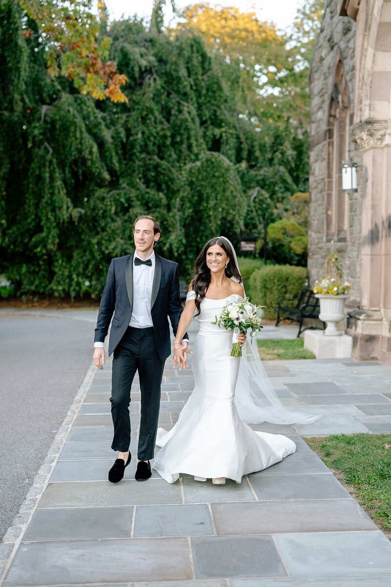 Kendall and Michael walking along a stone path