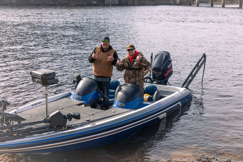 two guys fishing in a boat at castle rock