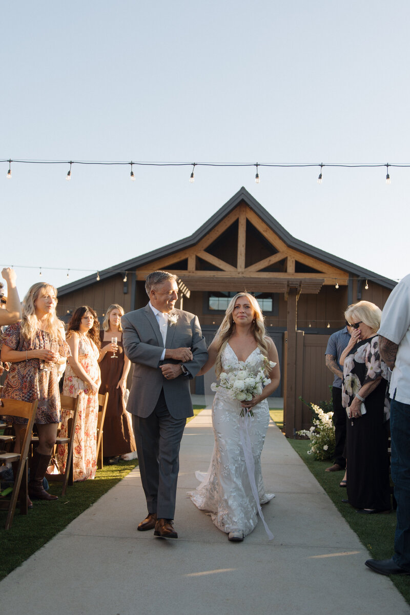 bride and father walking down the aisle