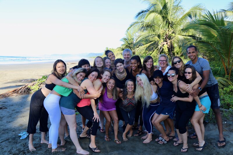 Graduates celebrating together after completing Soma Yoga Institute’s Costa Rica yoga teacher training program