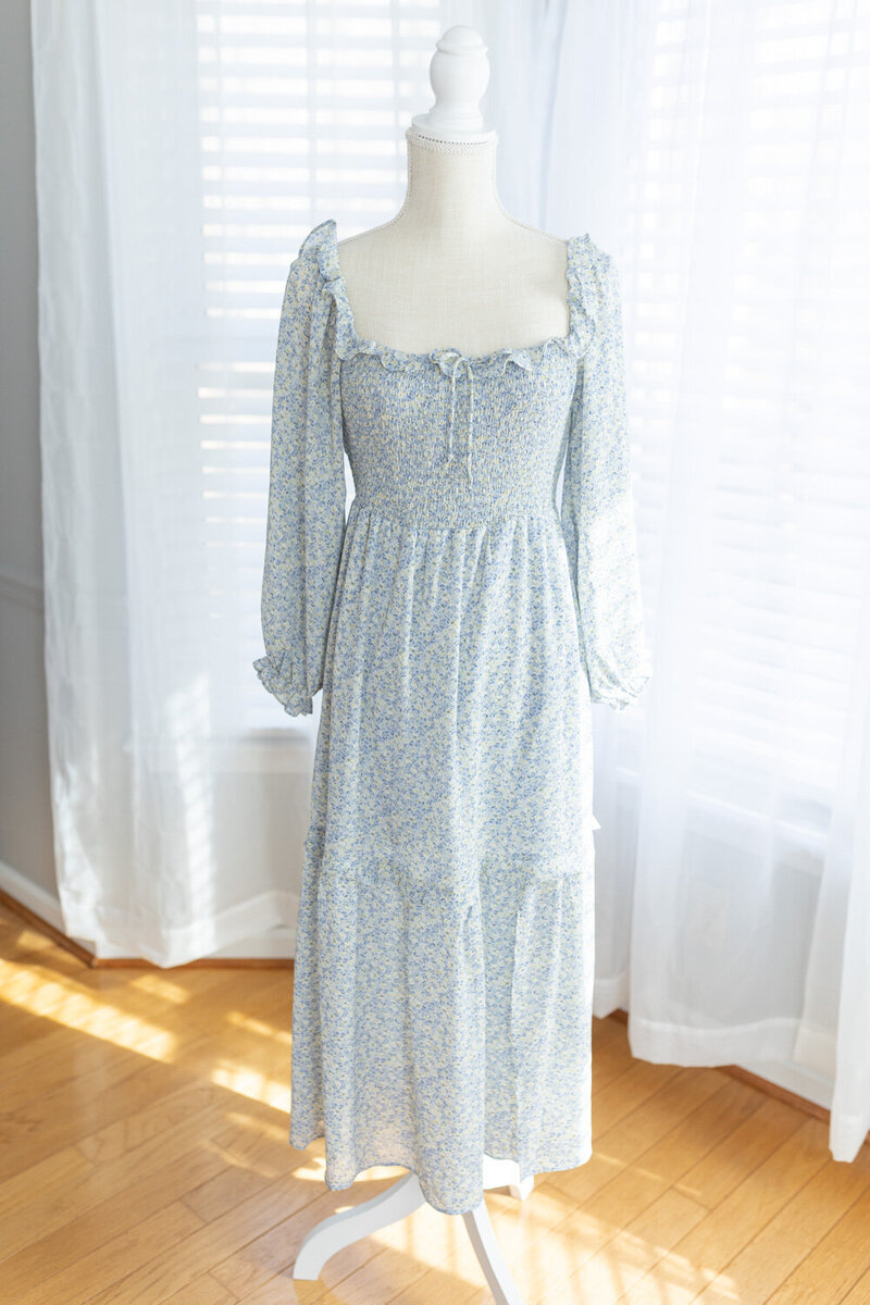 blue-long-sleeve-dress-with-small-yellow-flowers-and-ruffles