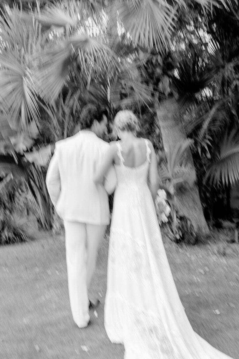 Bride and groom walk up memorial steps at their DC wedding