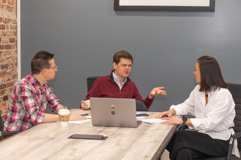 team talking together during a corporate business meeting Atlanta Brand Photographer