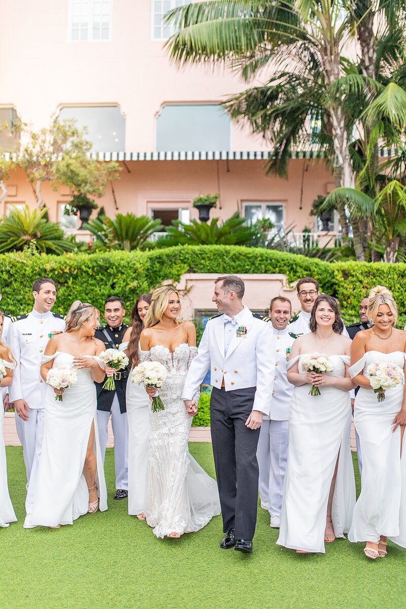 Bridal party walking in the gardens of La Valencia La Jolla photographed by Sherr Weddings based in San Diego, California,