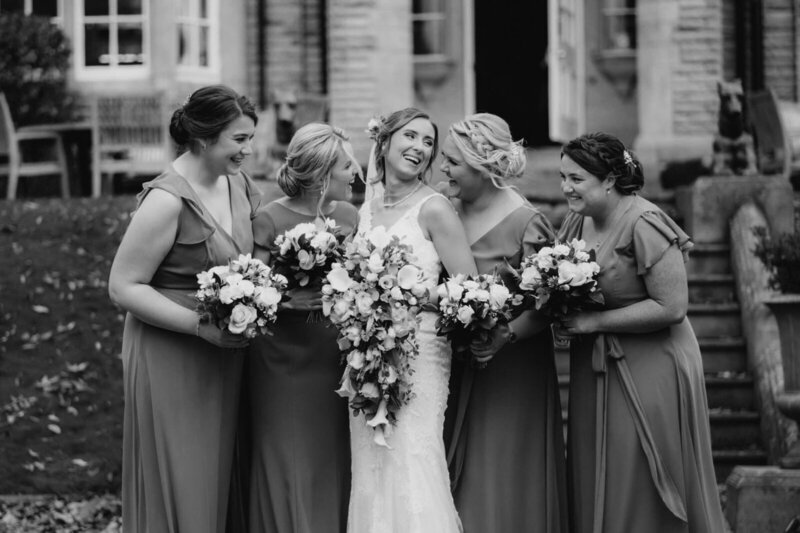 bride-with-bridesmaids-laughing-black-and-white-photo-abby-kaye-makeup-artist